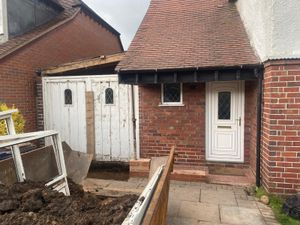 Preparation to extend the front of the existing garage and construct the new roof to tie in with the existing roof of the house