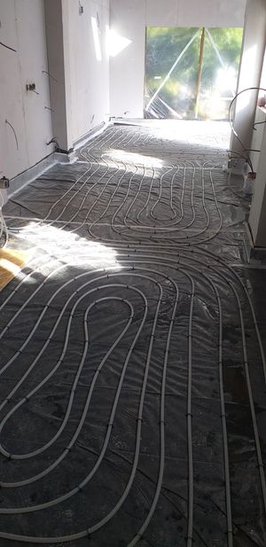 Insulated underfloor heating system laid throughout