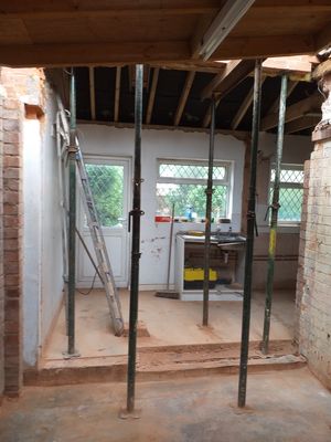 Garage wall removed, structural steam beams installed, knock through between existing utility and kitchen